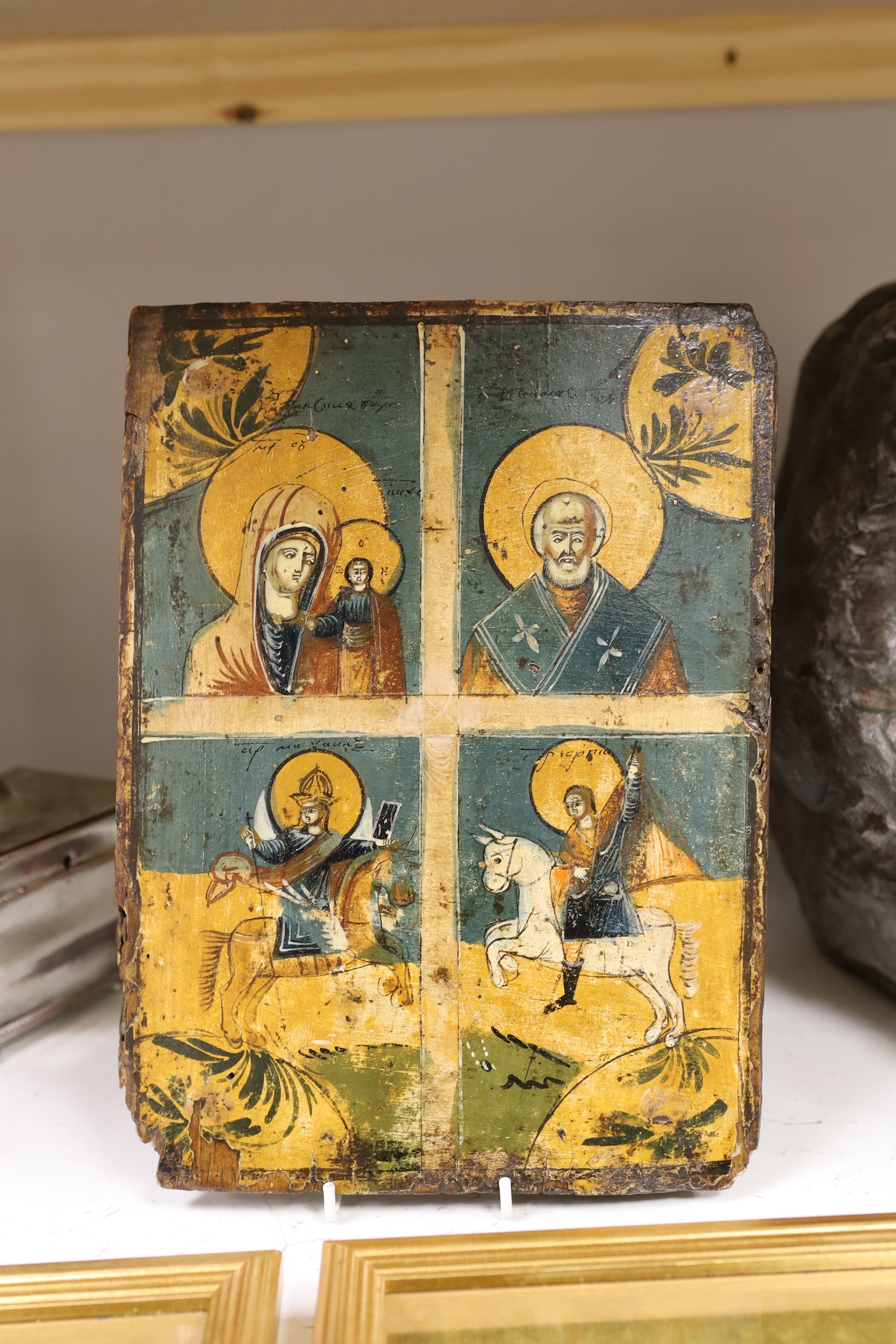 Eastern European School, tempera on wooden panel, Icon divided into four panels, 30 x 22cm, unframed